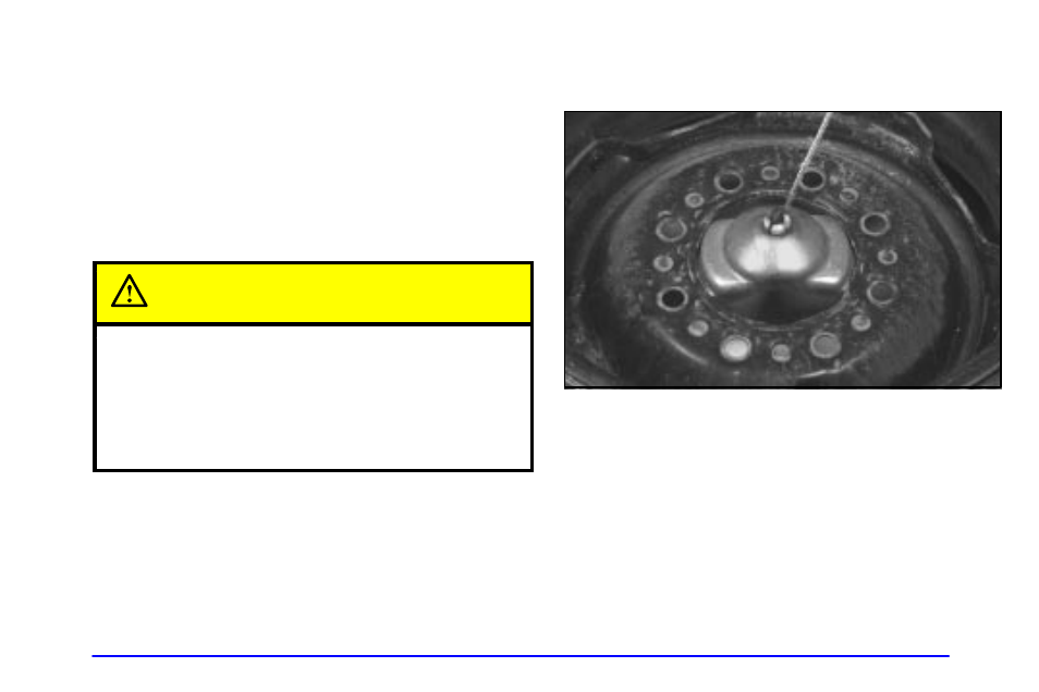 Storing a flat or spare tire and tools, Caution | GMC 2002 Savana User Manual | Page 264 / 411