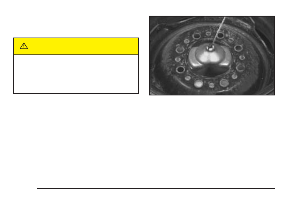 Storing a flat or spare tire and tools, Storing a flat or spare tire and tools -82, Caution | GMC 2005 Savana User Manual | Page 320 / 384