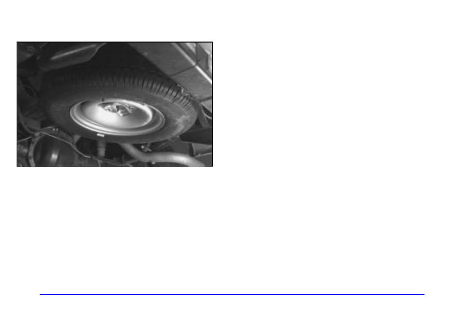 Removing the spare tire and tools | GMC 2002 Savana User Manual | Page 253 / 411