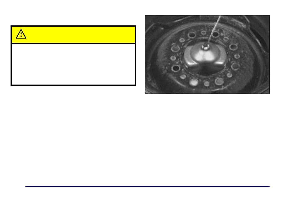 Storing a flat or spare tire and tools, Caution | GMC 2001 Savana User Manual | Page 266 / 412